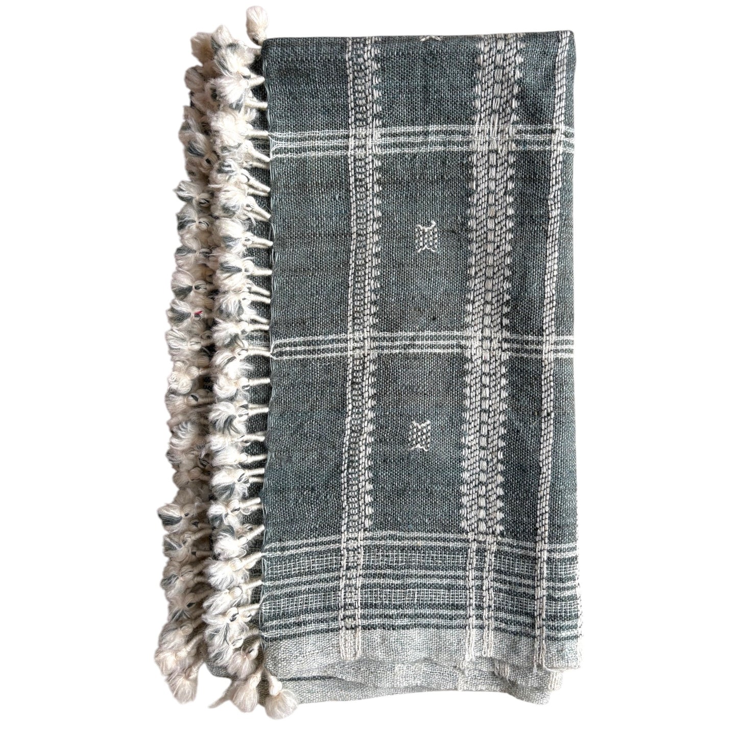 Slate grey woollen throw with tassels, folded