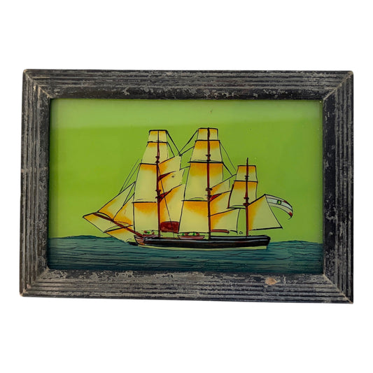 glass painting of a sailing boat in a wooden frame on a white background 