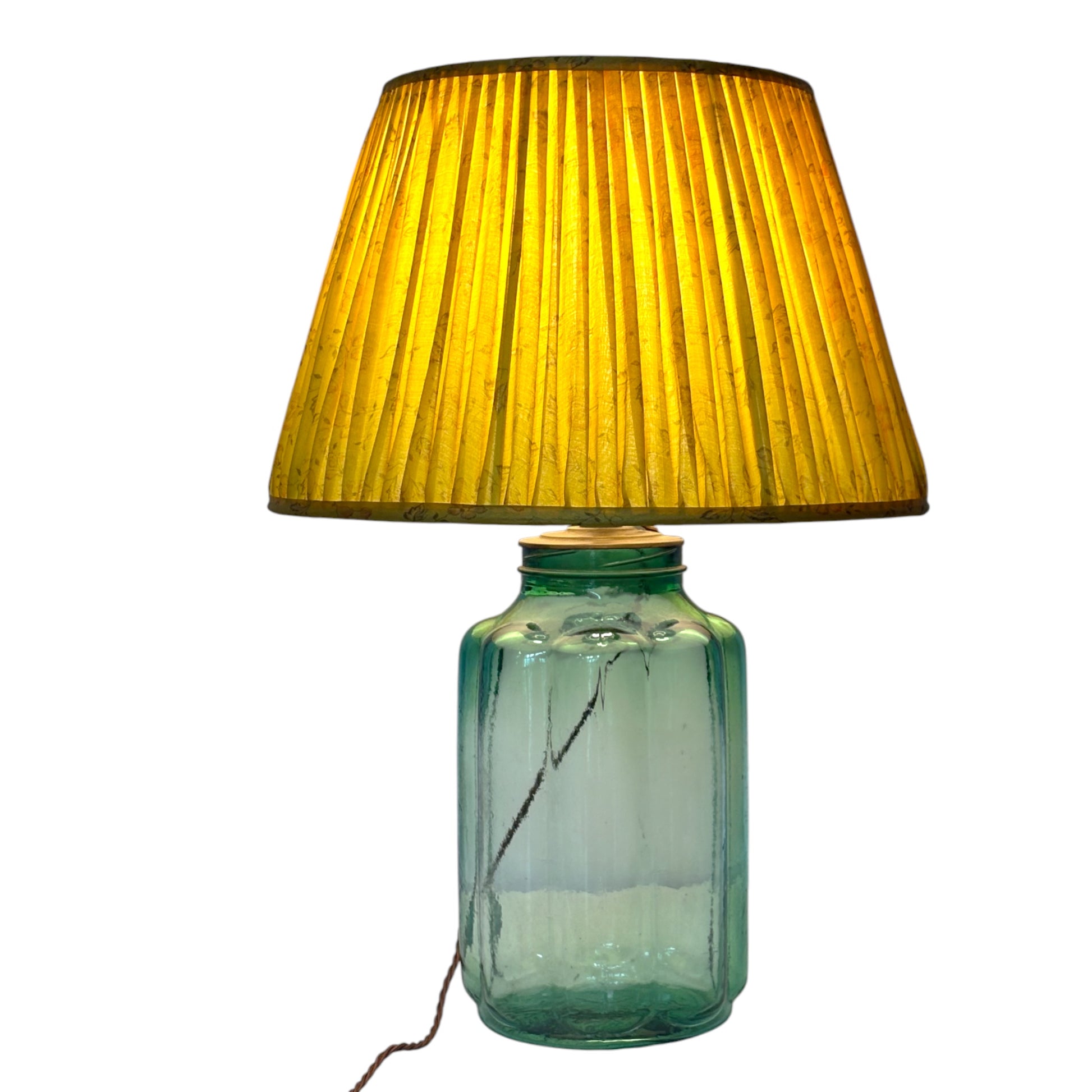 Lit sunflower yellow lampshade on Jelly glass lamp