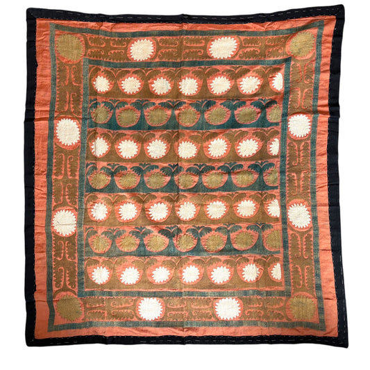 Decorative suzani square with intricate patterns 