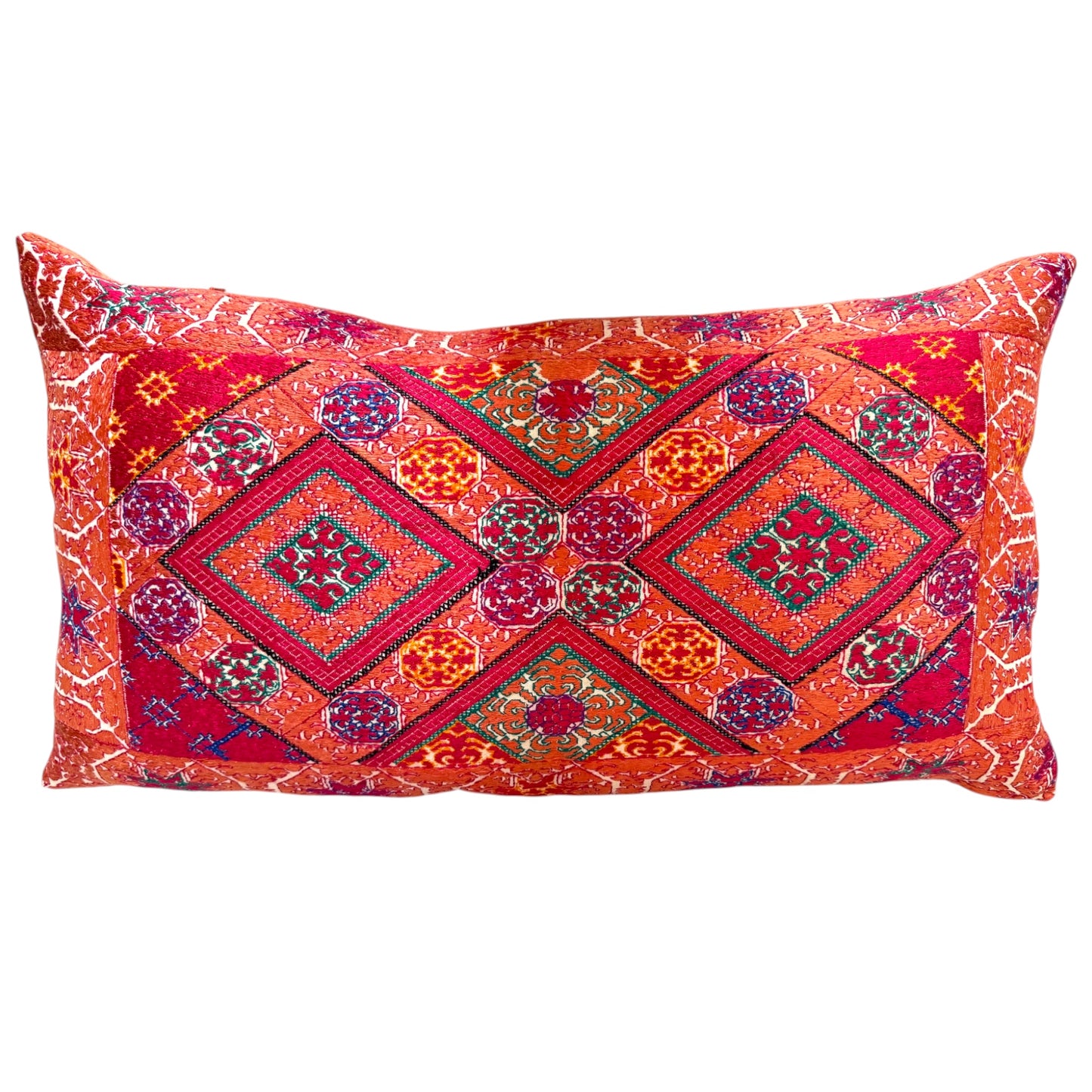 Swat Valley wedding cushion, front view, showing full silk-embroidered diamond medallion pattern in orange, red, purple, and green.