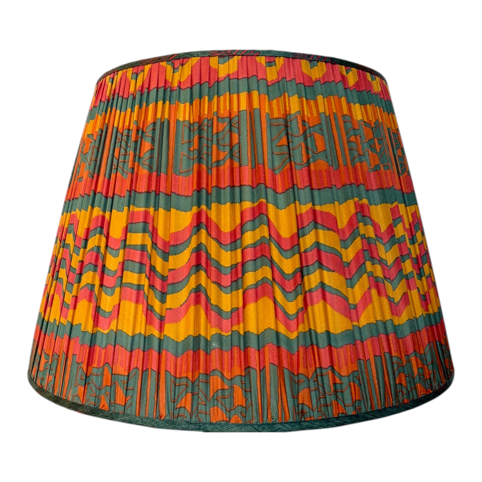 A gathered vintage silk sari lampshade featuring a vibrant, multicolored geometric pattern with stripes of orange, yellow, pink, and dark green on a white background.