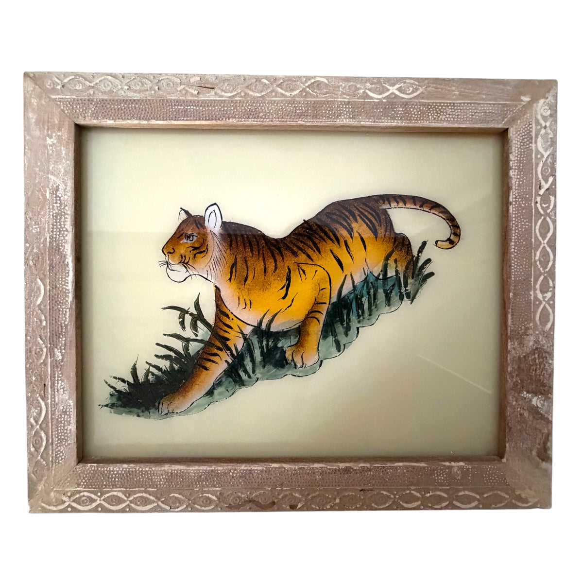 Hand-painted tiger prowling through tall grass, reverse glass painting in a silver embossed frame