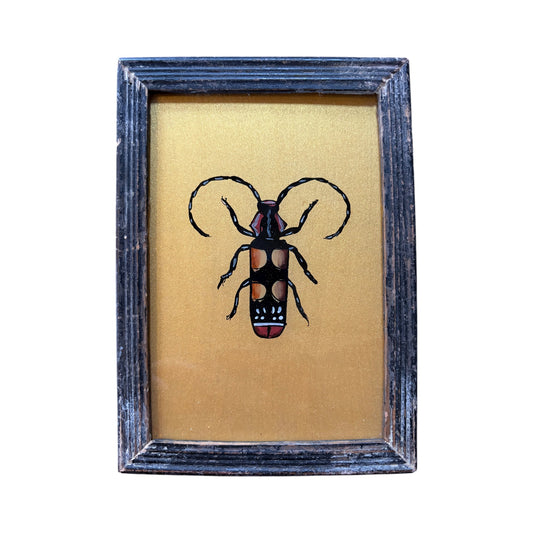 small gold beetle glass painting