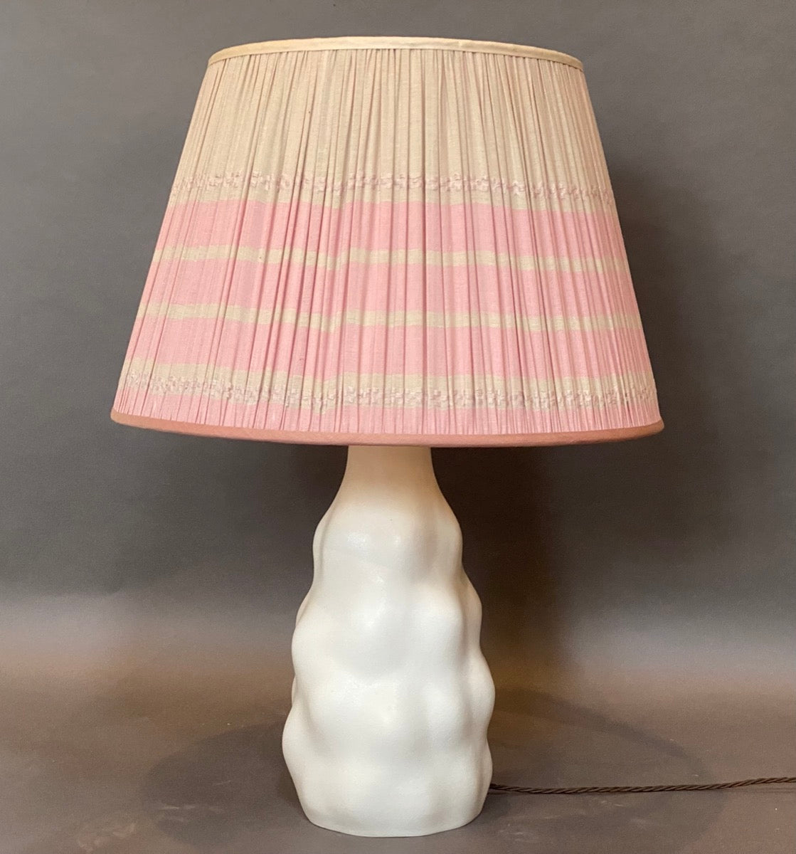 Assam pink cotton lampshade on IKI lamp