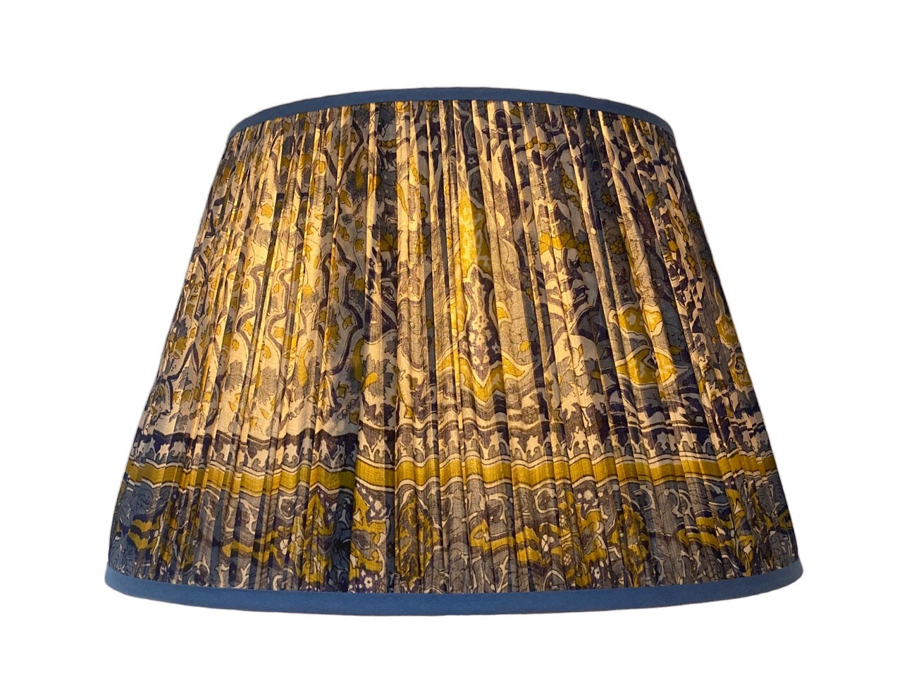 blue and yellow silk lampshade lit