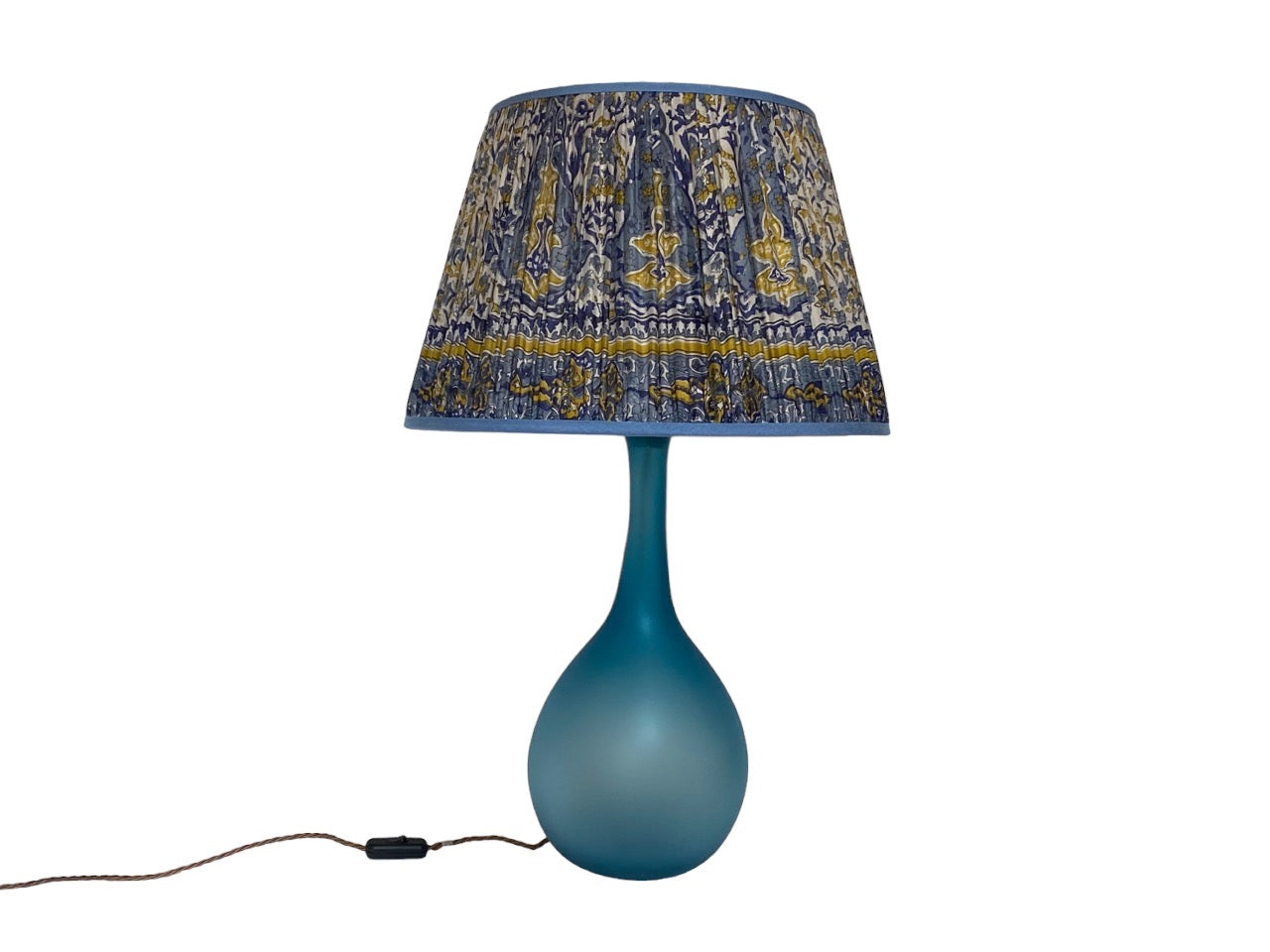 blue silk lampshade on glass lampbase