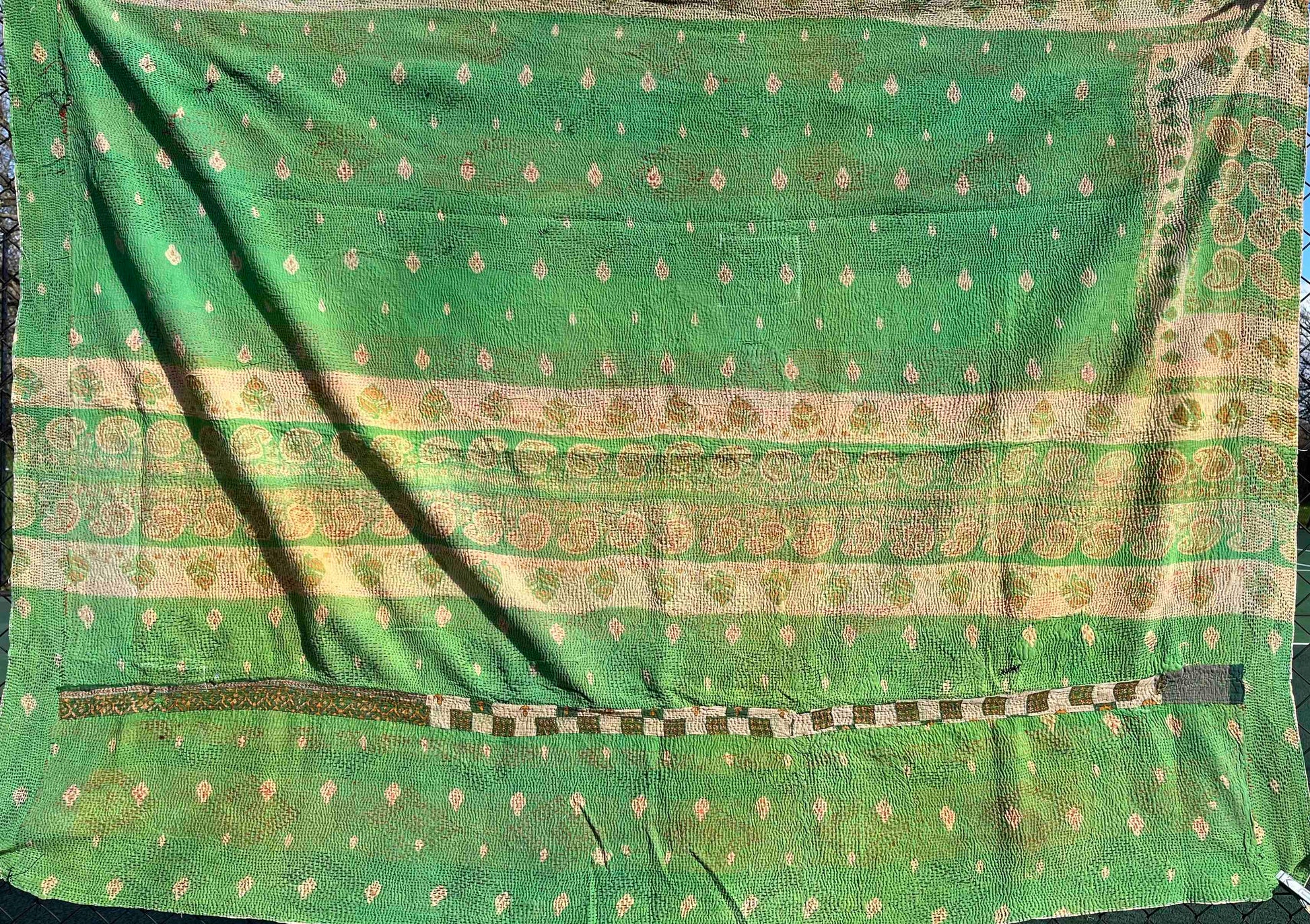 Bright green kantha quilt