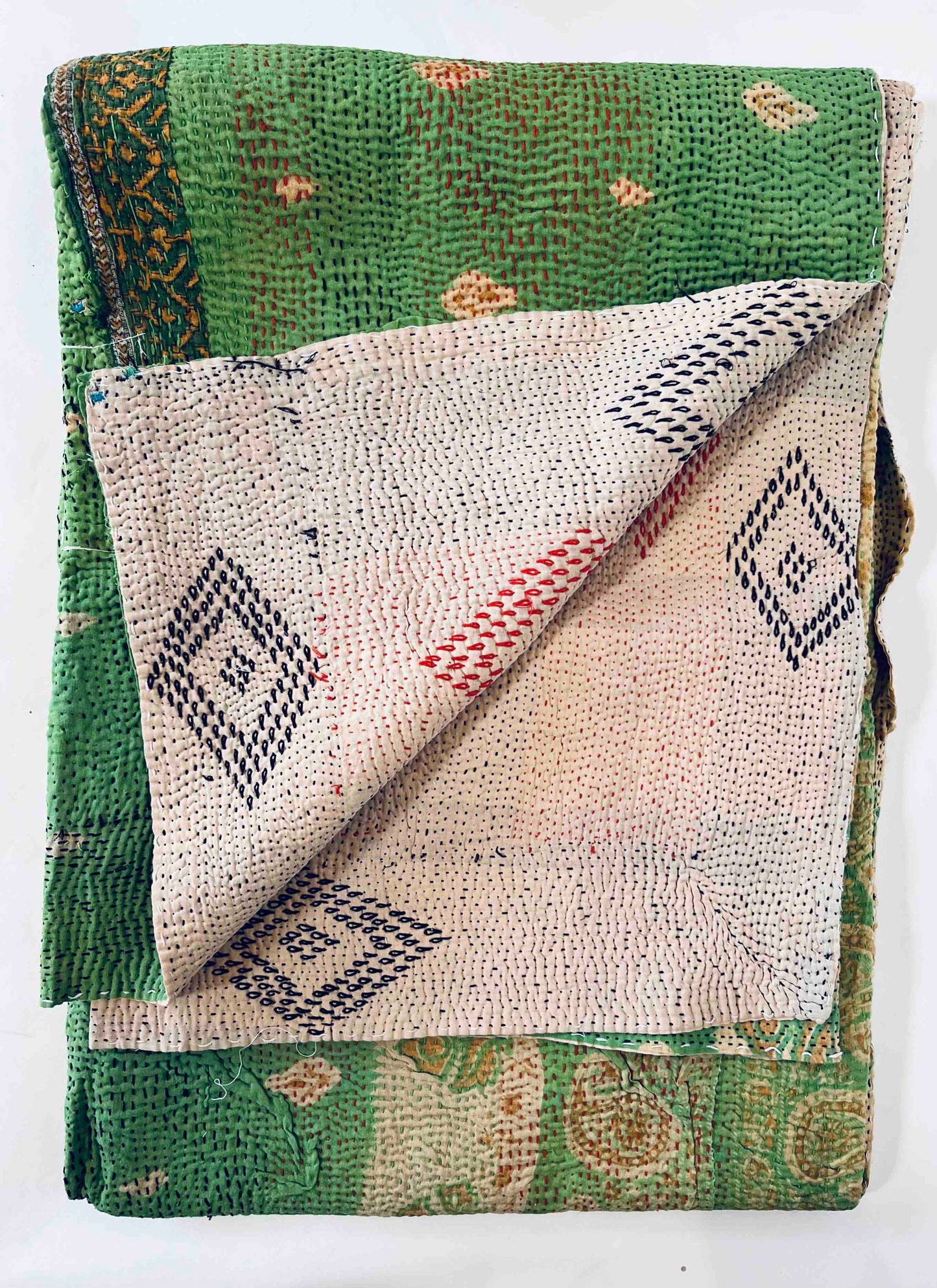 Bright green kantha quilt folded 