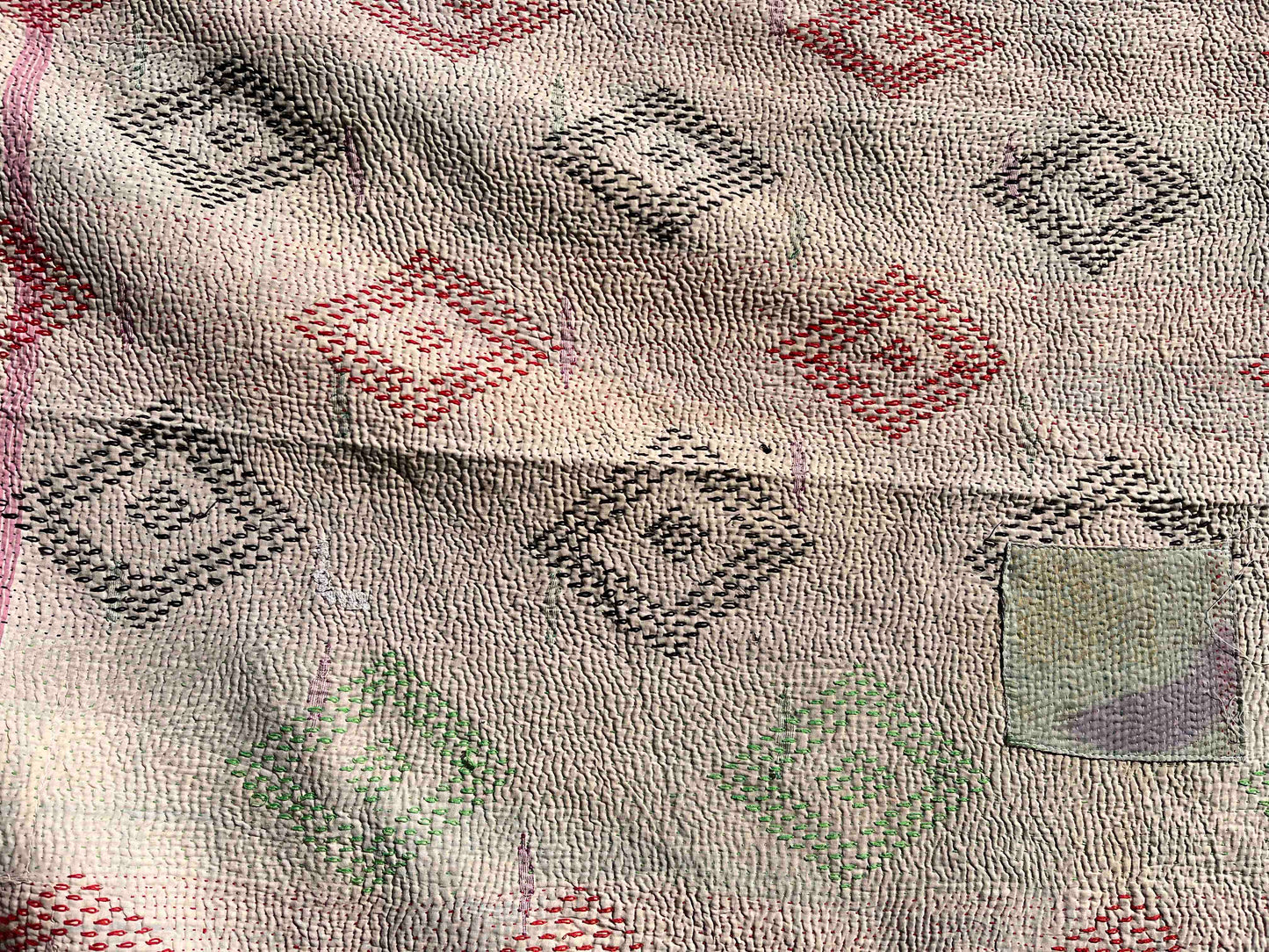 Bright green kantha quilt reverse close up
