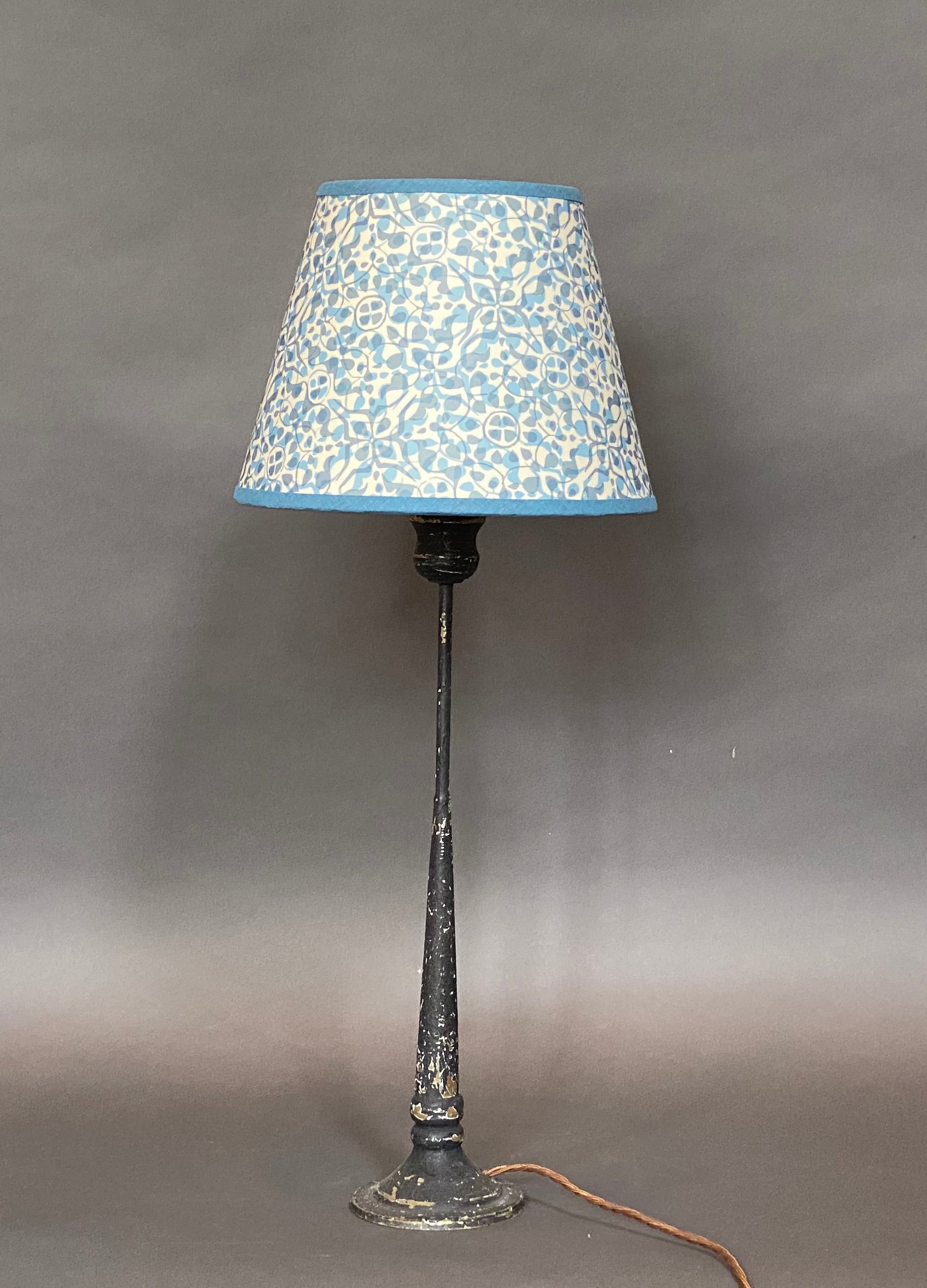 Dappled blue paper lampshade on lamp
