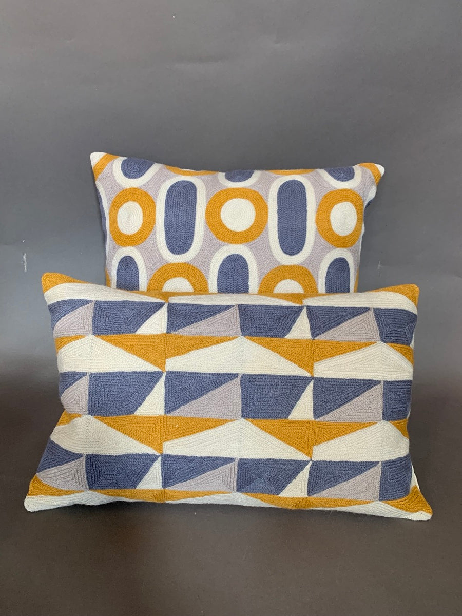 Blue and ochre crewel cushion