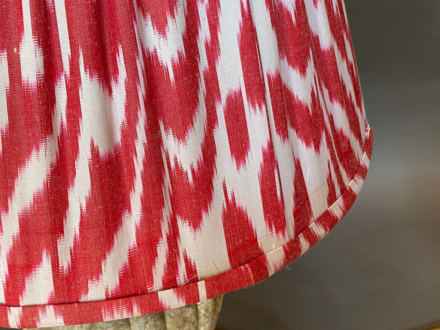 Red and white ikat silk lampshade close up
