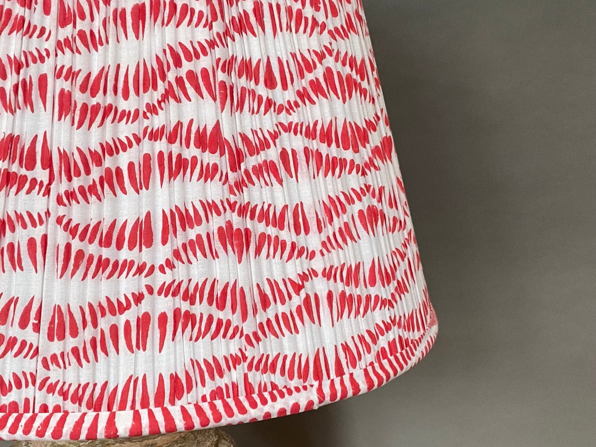Close up of the Cherry Bangla lampshade - white cotton shade with a red block printed design