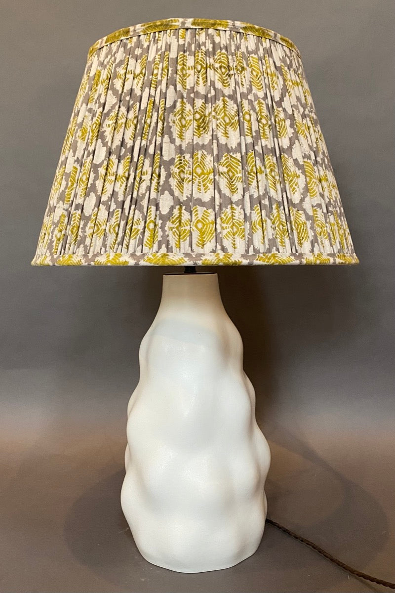 Mustard yoyo cotton lampshade on lamp