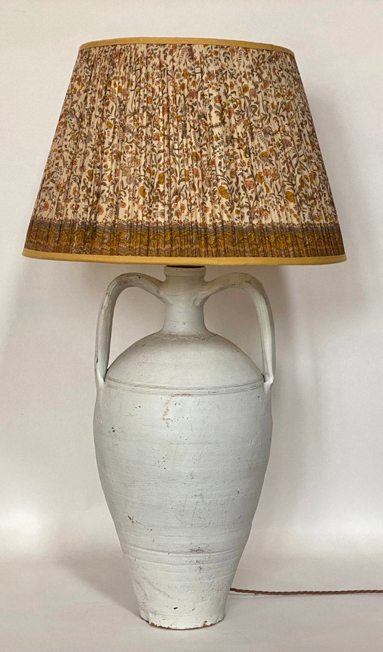 Cream and Yellow Paisley silk lampshade with border shown on a turkish urn lamp base