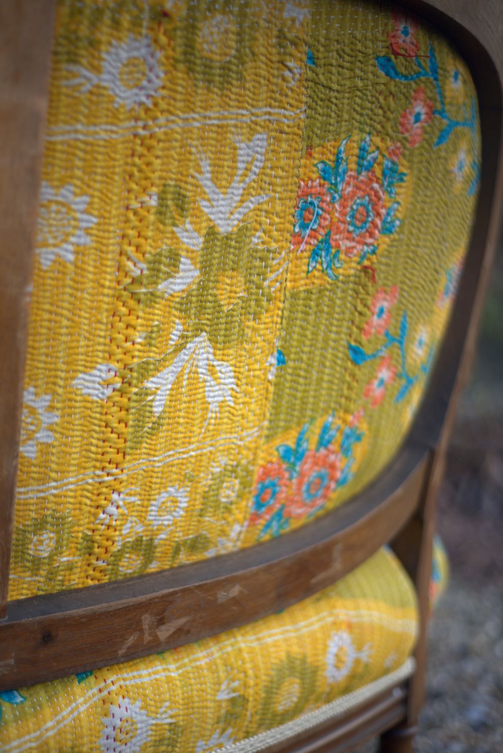 19th century yellow french sofa close-up from back view